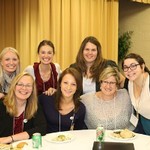 A group of women smile